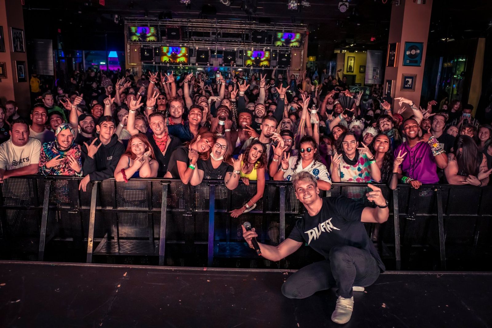 Terry on stage in front of a packed crowd after a DJ set