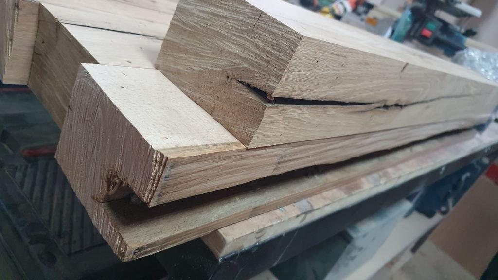 Solid oak beams on the workbench before finishing